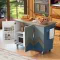 Îlot de cuisine roulant de style rustique avec plateau en chêne à abattant, étagères de rangement internes et porte-serviettes.
